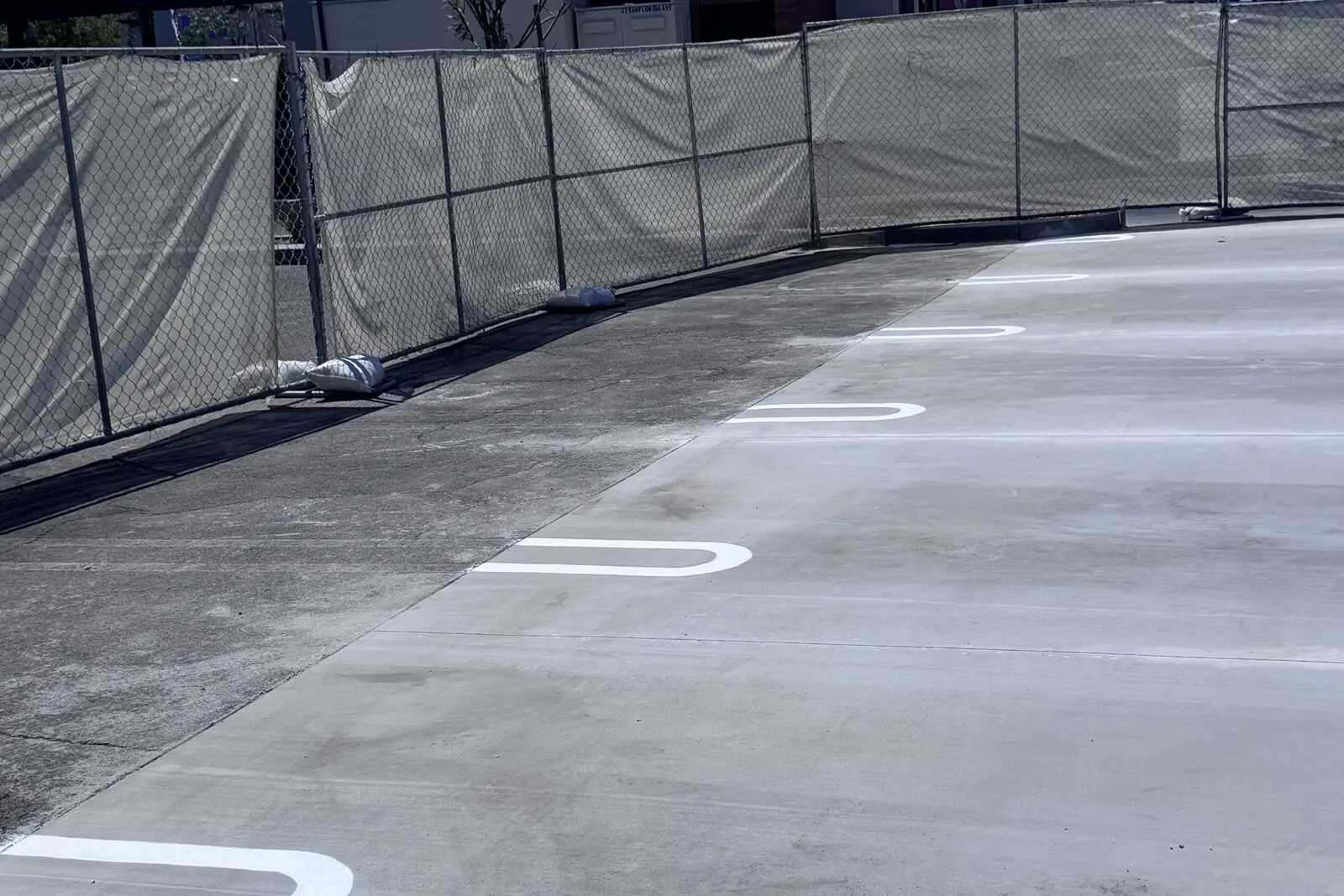 Raising Cane's concrete improvements, Hemet CA — fresh concrete pad with new parking line stripes